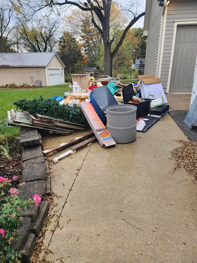 Dumpster being loaded with debris for 30 Yard Dumpster Rental in Wanaque